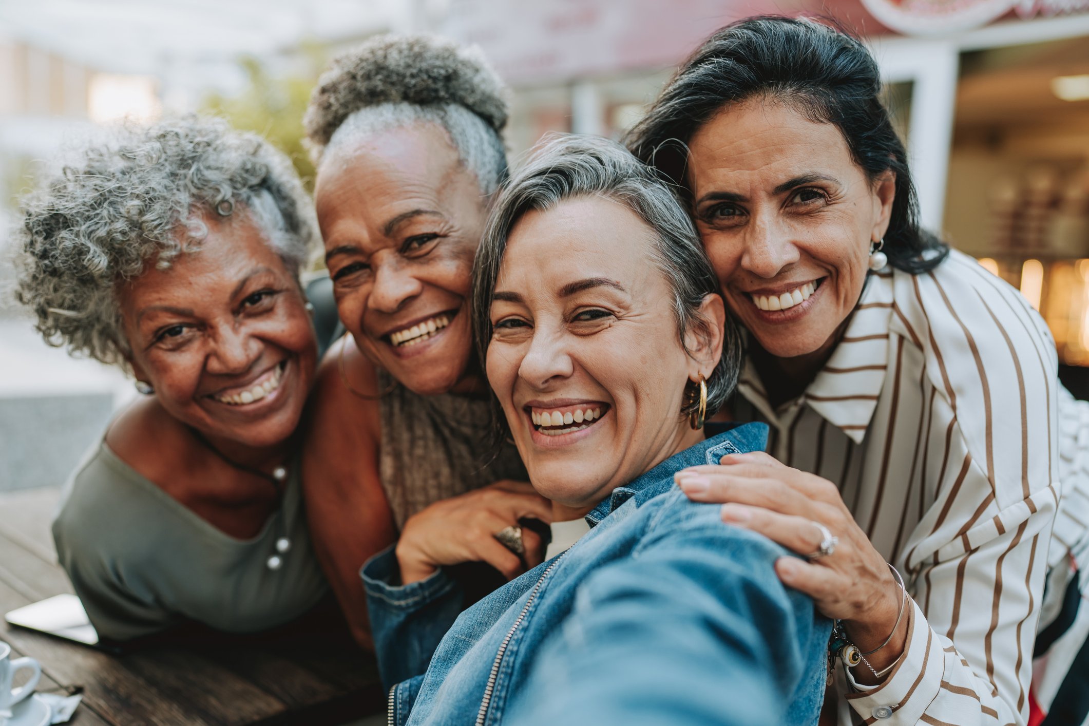 group of midlife women taking selfie